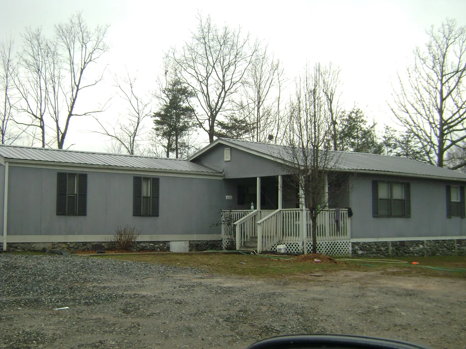 Metal roof over a manufactured home with a covered front porch in Lake Mary